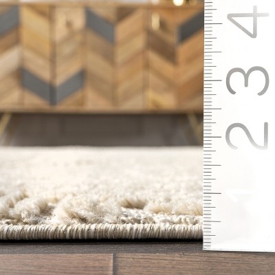 Beige Geometric 4' x 6' Synthetic Area Rug with Tassels