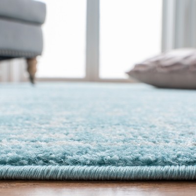 Aqua and Ivory Round Hand-Knotted Synthetic Rug