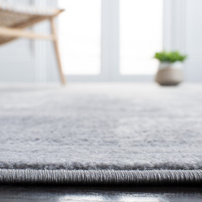 Light Grey and Ivory Abstract Synthetic Runner Rug