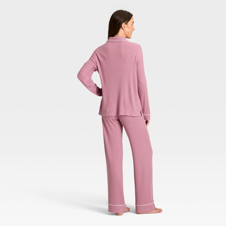 Pink colored pajama set with long sleeves and full-length pants, shown from the back.
