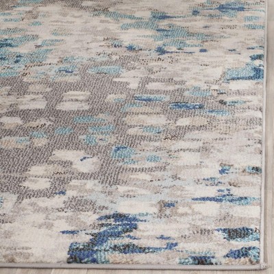 Boho-Chic Gray Geometric Synthetic 10' x 14' Area Rug