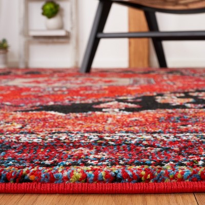 Vintage Red and Black Synthetic Oriental Area Rug, 5'3" x 7'6"