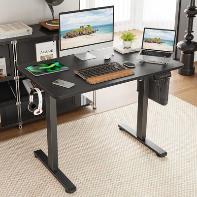 Desk setup with three monitors and accessories