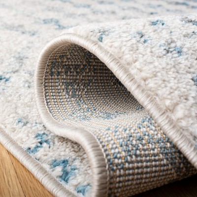 Ivory & Turquoise Geometric 9' x 12' Reversible Synthetic Rug