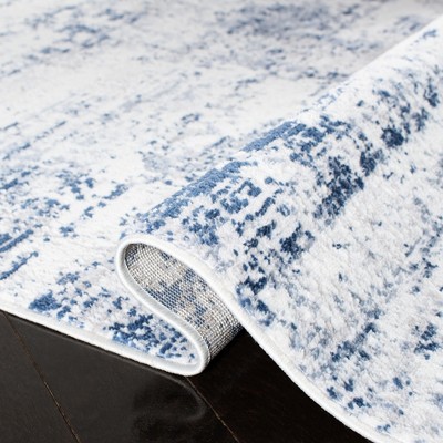 Ivory and Navy Abstract Synthetic Round Rug, 4' x 6'