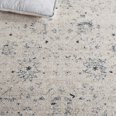 Ivory and Blue Distressed Polyester Area Rug 9' x 11'6"