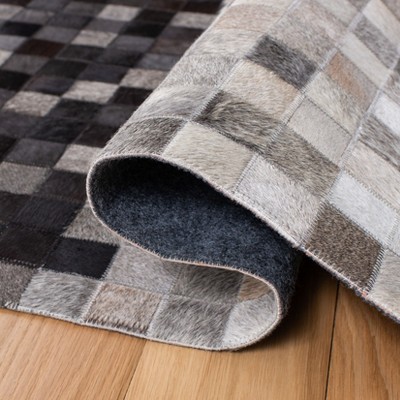 Handmade Black and Ivory Geometric Cowhide Area Rug