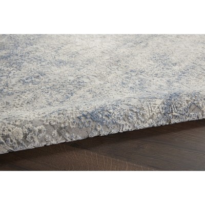 Ivory Elegance 5'3" x 7'3" Synthetic Vintage Persian Rug