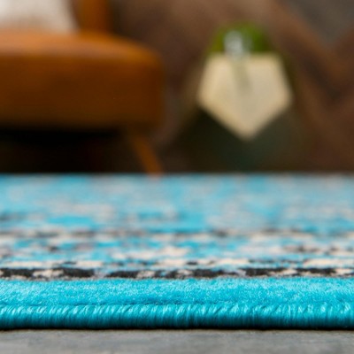 Turquoise and Ivory Synthetic 4' x 6' Easy-Care Rectangular Rug