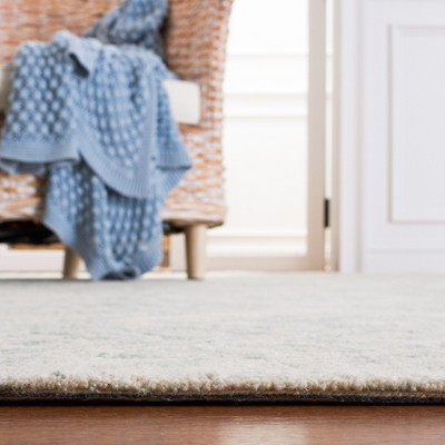 Handmade Light Blue Wool and Synthetic Tufted Rug