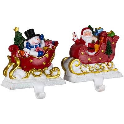 Santa and Snowman Sleigh Ride Resin Stocking Holders Set