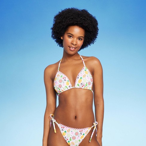 Young woman posing in bikini without panties, bottom of bikini on head  Stock Photo