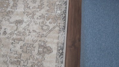 Distressed Orange and Beige Floral 6' x 9' Synthetic Area Rug