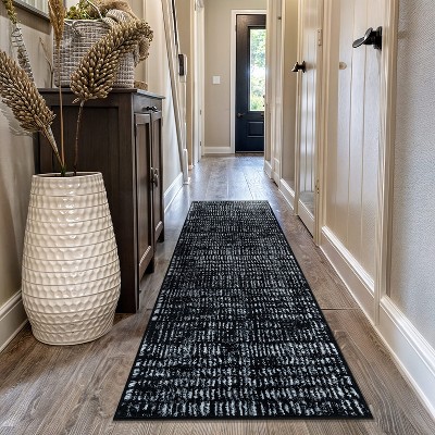 Black and Ivory Geometric Polypropylene Area Rug 2' x 7'