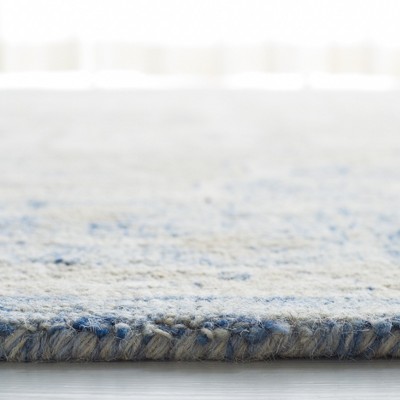 Ivory and Blue Handmade Wool Medallion Area Rug