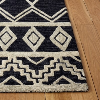 Handmade Black and Ivory Wool Abstract Area Rug