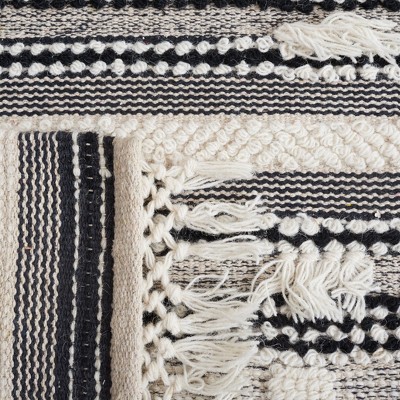Handmade Black and Ivory Wool Flat Woven Area Rug