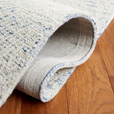 Handmade Blue Wool 5' x 8' Tufted Area Rug