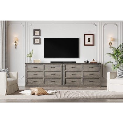 Wide view of two matching grey dressers in a living room setup