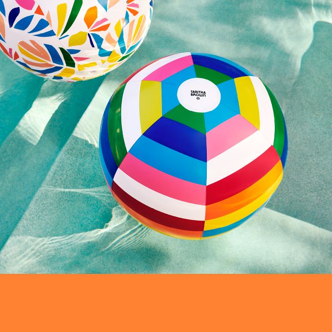 A colorful, inflatable beach ball set in palm print and multi-stripe.