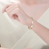 14K Gold-Plated Bangle Bracelet adorned with Cubic Zirconia, offering a sleek and sophisticated design with a touch of sparkling elegance. - 2 of 3