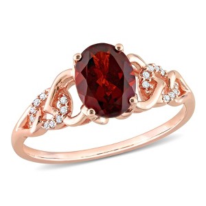 EVERLY JEWELRY | 10K Rose Gold 1 3/8 CT TGW Oval Garnet and Diamond Accent Link Ring - 1 of 4