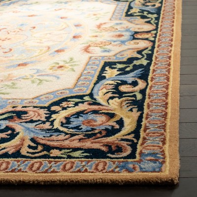 Ivory and Navy Handmade Wool Floral Area Rug