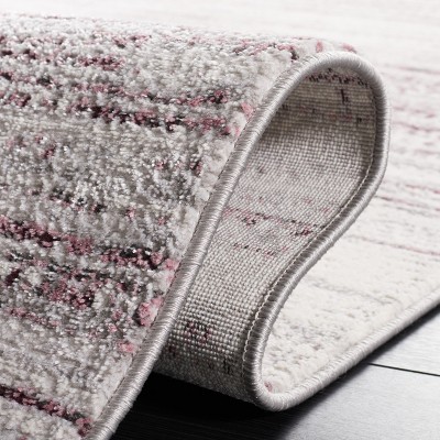 8' x 10' Purple and Ivory Abstract Synthetic Rug