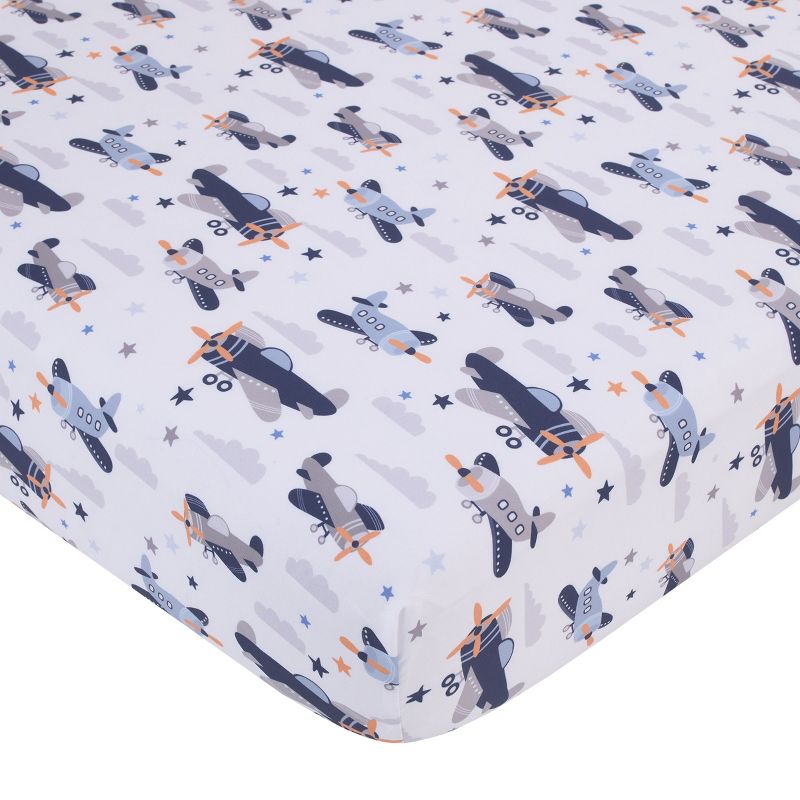 Little Love by NoJo Soar High Little One Navy, Light Blue, Orange, and White Airplanes, Clouds, and Stars Fitted Crib Sheet, 1 of 4