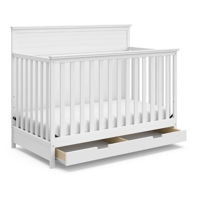 white crib with storage drawer