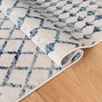 Ivory and Turquoise Geometric Synthetic Area Rug