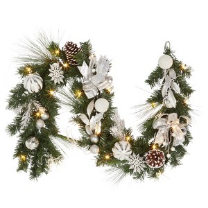 6-foot pre-lit Christmas wreath adorned with pine cones, berries, poinsettias, bows, and spherical ornaments, with 20 warm white lights. - 1 of 4