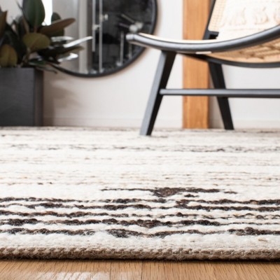 Handmade Black and Ivory Wool 3' x 5' Rectangular Rug