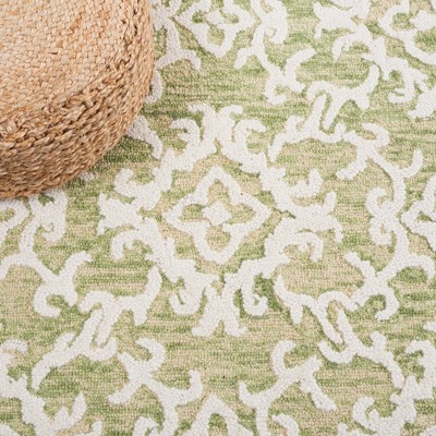 Light Green and Ivory Floral Wool 6' x 9' Tufted Area Rug