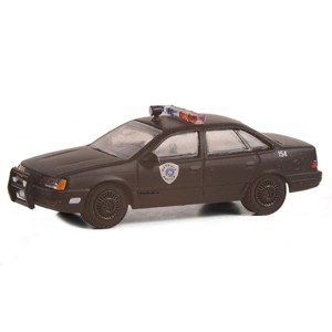 Greenlight Collectibles 1/64 1986 Ford Taurus LX, Weathered Robocop, Anniversary Collection Series 15, 28120-D - 1 of 2