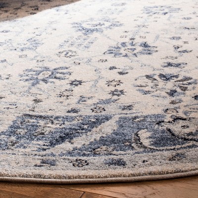 Ivory and Blue 9' x 12' Synthetic Stain-Resistant Area Rug