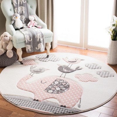 Carousel Kids Round Pink and Ivory Synthetic Area Rug