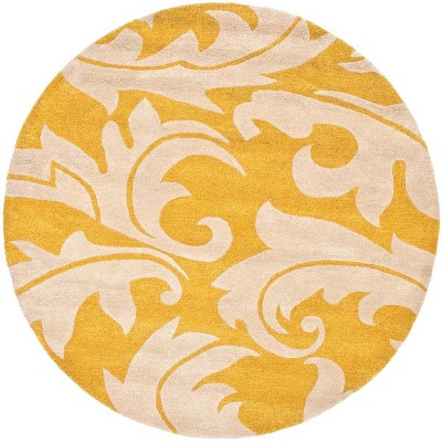 Handmade Round Gold and Ivory Wool Area Rug