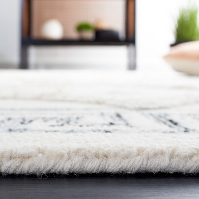 Ivory and Black 5' x 8' Hand Tufted Wool Shag Rug