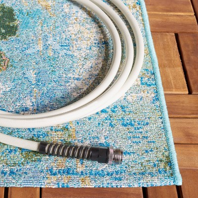 Reversible Light Blue Synthetic 4' x 6' Stain-Resistant Area Rug