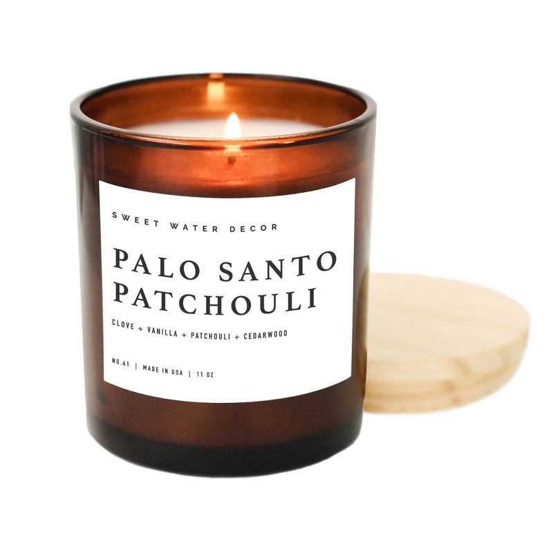 Sweet Water Decor Palo Santo Patchouli 11oz Amber Jar Soy Candle, 1 of 6