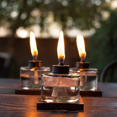 Clear Glass and Brown Wood Tabletop Torch