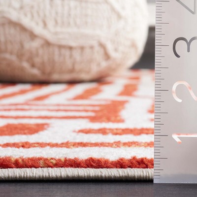 Ivory and Terracotta Geometric Synthetic Area Rug