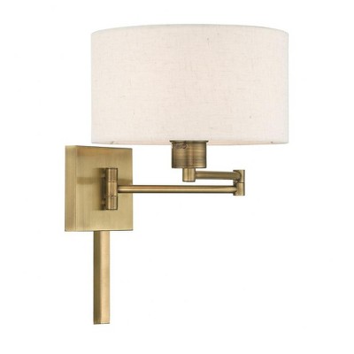 Antique Brass Swing Arm Wall Lamp with Oatmeal Shade
