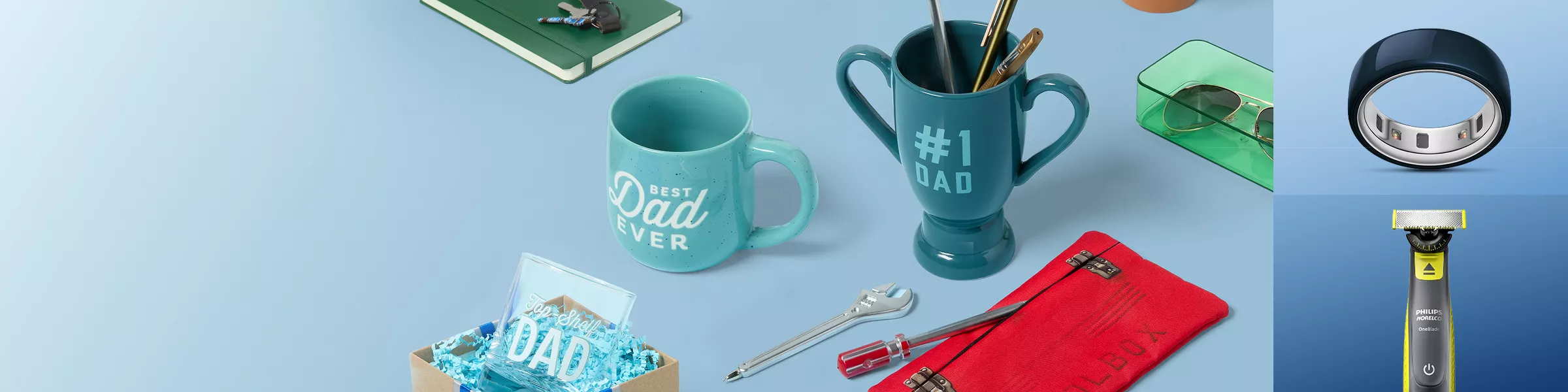 Collection of Father's Day items for Dads. Such as mugs, pens, trimmer and a oura ring.