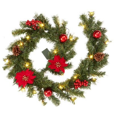 6-foot pre-lit Christmas wreath with 20 lights, pine cones, red berries, and poinsettias, suitable for indoor/outdoor decoration.