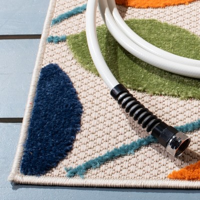 Ivory and Green Geometric Synthetic Indoor/Outdoor Rug