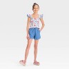 Girls' Stitch Smock Tank Top - The Disney Collection by Cat & Jack™ Cream - 3 of 3