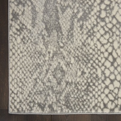 Ivory and Grey 5' x 7' Animal Print Synthetic Area Rug