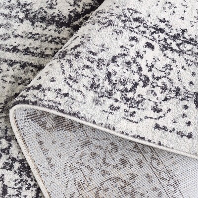 Ivory and Black Reversible Easy-Care Synthetic Area Rug - 6'7" x 9'